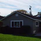 We not only replaced the old bronze single pane windows with new energy effecient double pane white vinyl windows, but we also stuccoed parts of this house. 