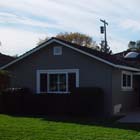 We not only replaced the old bronze single pane windows with new energy effecient double pane white vinyl windows, but we also stuccoed parts of this house. 