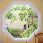 We replaced this old single pane bronze aluminum window with an AMSCO white interior vinyl retro-fit window.